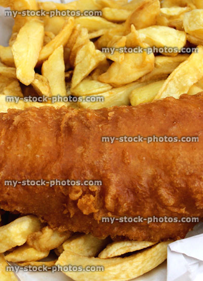 Stock image of fish and chips, greasy battered cod, fish supper, greaseproof paper