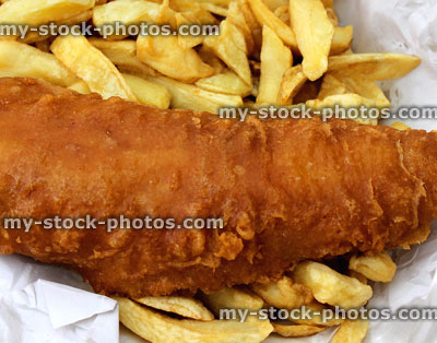 Stock image of cod and chips, battered fish, chip shop takeaway, unhealthy greasy food