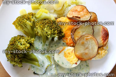 Stock image of fish pie, cod, haddock, broccoli, boiled egg, parsley sauce, potatoes