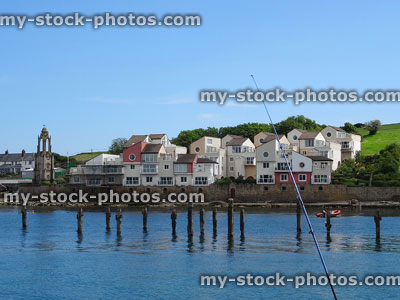 Stock image of fishing rod at seaside town, sea water harbour fish