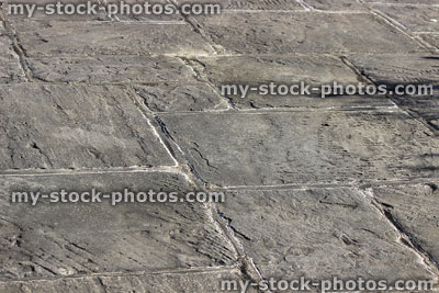 Stock image of irregular grey flagstone paving slabs, garden patio stones