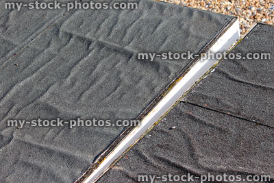 Stock image of bitumen roofing felt on beach huts, wrinkled / creased