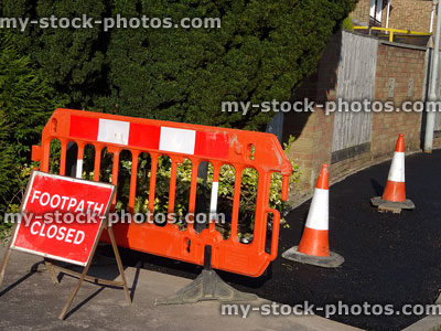 Stock image of 'Footpath Closed' sign on new tarmac pavement, bollards