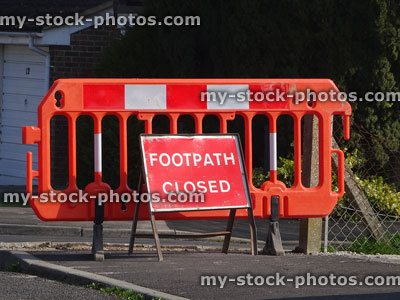 Stock image of red white sign on pavement / sidewalk saying 'Footpath Closed'