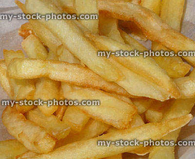 Stock image of crispy French fries close up, from takeaway chip shop