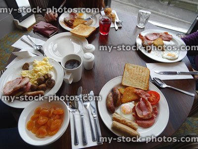 Stock image of table set for family breakfast, English fry ups / fried breakfasts