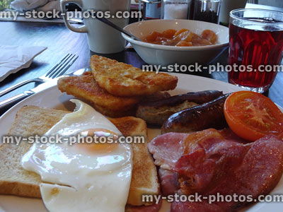 Stock image of fried breakfast fry up food, sausages, bacon, fried egg, toast