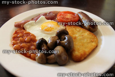 Stock image of fried breakfast, with mushrooms, sausage, bacon, egg, beans