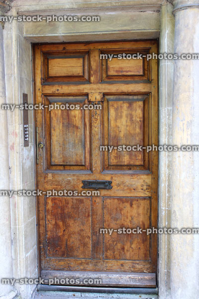 Stock image of wooden front door with Georgian surround, Bath stone