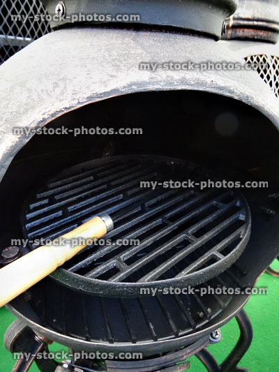 Stock image of metal chiminea / chimenea outdoor fireplace with barbecue grill
