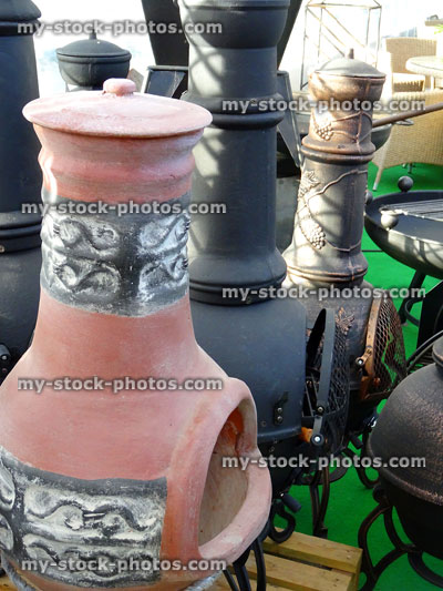 Stock image of clay, terracotta and metal garden chimineas / chimeneas, wood burners