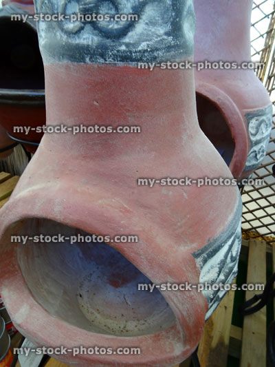 Stock image of terracotta clay garden chiminea / chimenea outdoor fireplace chimneys