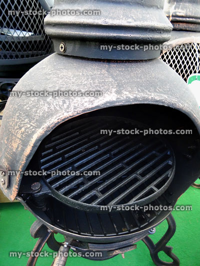Stock image of metal garden chiminea, outdoor fireplace with grill tray
