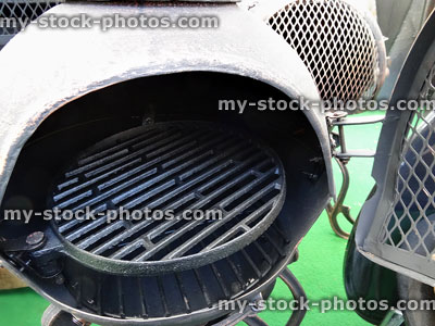 Stock image of garden chimineas / fireplaces made from metal, wire doors