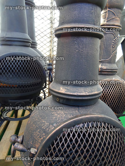 Stock image of metal chimeneas / chimineas group, outdoor fireplaces with chimneys