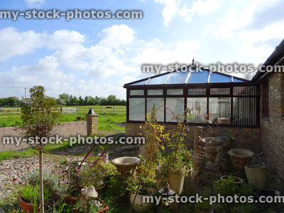 Stock image of newly built square conservatory with glass pyramid roof
