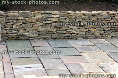 Stock image of garden under construction, raised beds, drystone walls, paving stones, hardscaping / landscaping