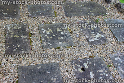 Stock image of square paving stones / flagstones surrounded by fine gravel