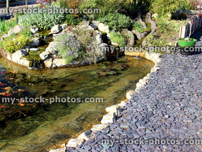 Stock image of garden fish pond with waterfalls and rockery