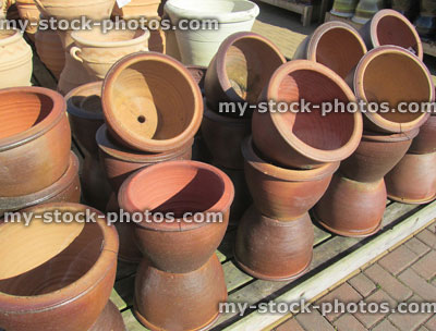 Stock image of stack of terracotta pots / planters at garden centre