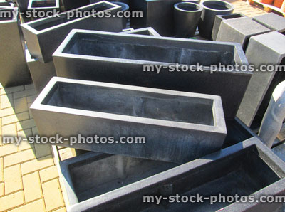Stock image of granite effect fibreglass garden planting troughs