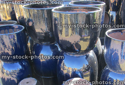 Stock image of stack of blue glazed earthenware garden pots