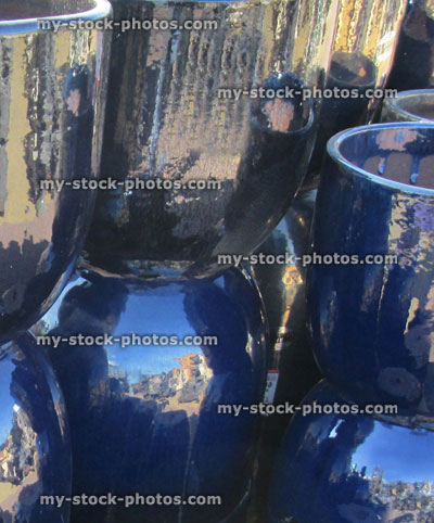 Stock image of blue glazed stone / clay pots at garden centre