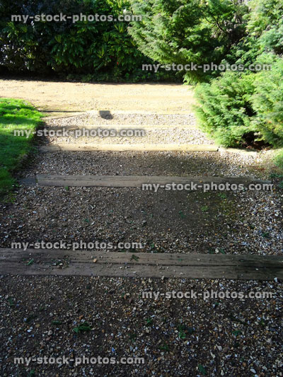 Stock image of rustic garden steps, wooden railway sleepers / planks, gravel