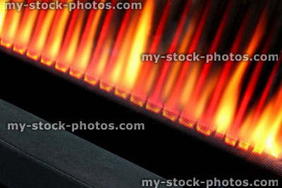 Stock image of line of gas fire flames, modern gas fire burning, heat