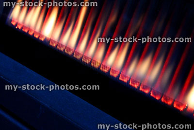 Stock image of line of gas fire flames, modern gas fire burning, heat