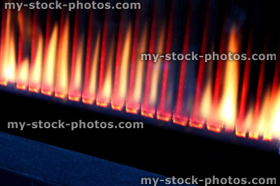 Stock image of line of gas fire flames, contemporary gas fire burning, heat