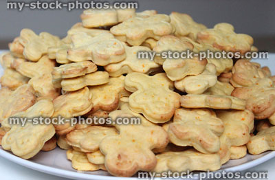 Stock image of freshly baked carrot and ginger gingerbread men biscuits / cookie cutters, moulded