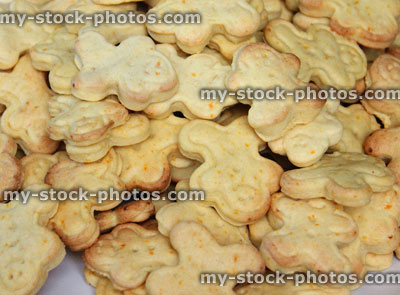Stock image of freshly baked carrot and ginger gingerbread men biscuits / cookie cutters, moulded