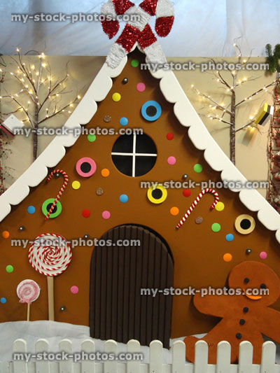 Stock image of large life size gingerbread house model, gingerbread man, Christmas decorations, winter display