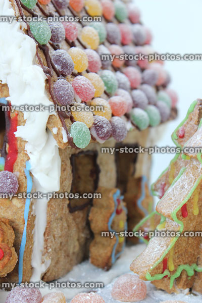 Stock image of jelly sweets and icing decorating gingerbread house roof