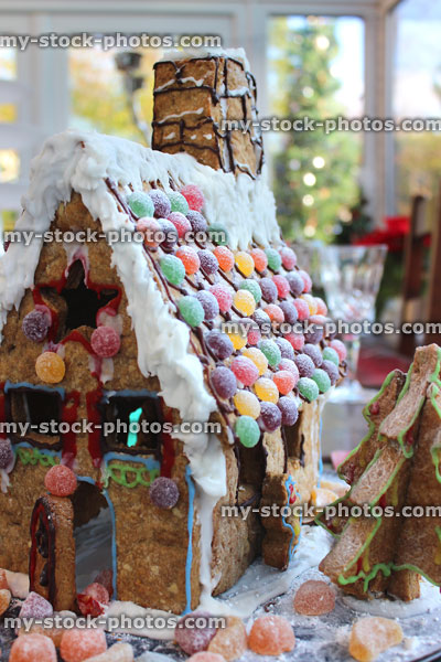 Stock image of decorated gingerbread house with piped icing and jellies