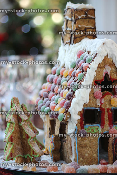 Stock image of gingerbread house side view with biscuit Christmas trees / sweets