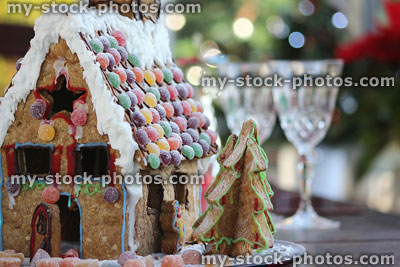 Stock image of homemade gingerbread house with sweets, icing, biscuit Christmas tree