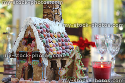 Stock image of gingerbread house with icing sugar snow and sweets