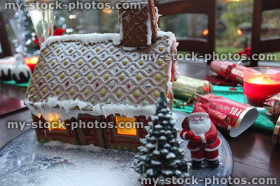 Stock image of small gingerbread house with Father Christmas / Santa Claus
