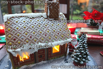 Stock image of gingerbread house with decorated biscuit roof, Christmas tree