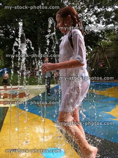 Stock image of young Girl Playing in a Fountain at a Splash Pad
