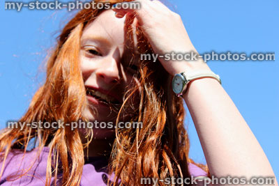 Stock image of girl with tousled, messy red hair