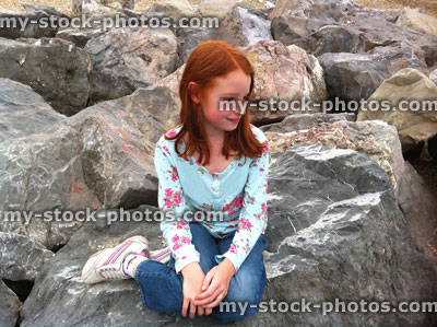 Stock image of girl on rocks Little Mermaid Pose