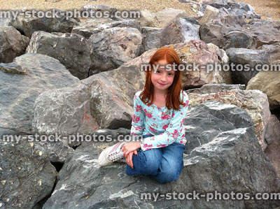 Stock image of Girl in Little Mermaid Pose on Rocks