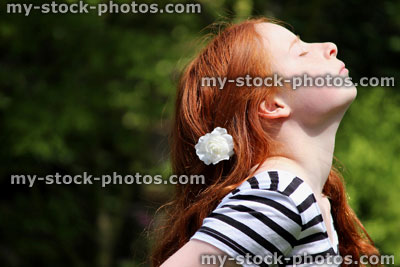 Stock image of beautiful young girl enjoying the sun in garden