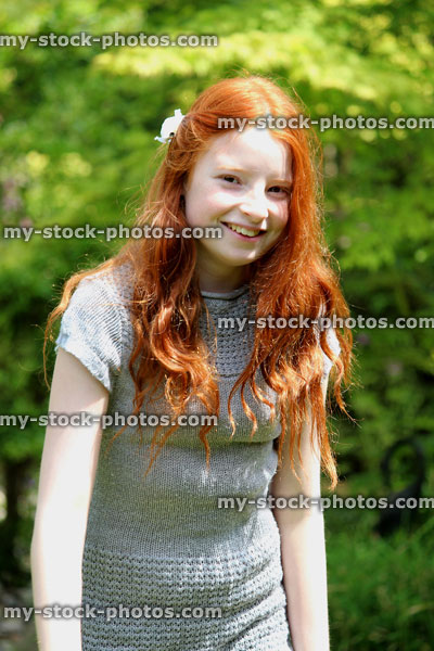 Stock image of happy girl in garden, smiling, laughing in sunshine