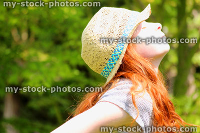 Stock image of pretty young girl enjoying the sun in garden