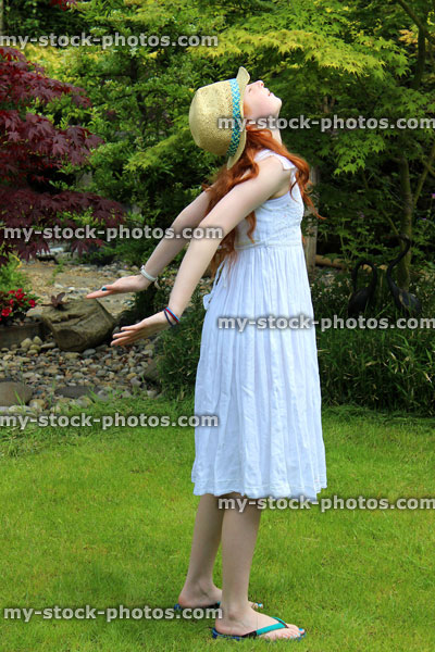 Stock image of pretty young girl enjoying the sun, sunny garden