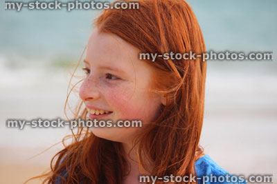 Stock image of girl standing on beach by sea, seaside summer holiday, portrait